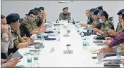  ?? HT PHOTO ?? State police chief Ashok Kumar chairs a meeting of senior police officers in Dehradun on Tuesday.