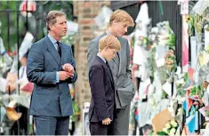  ??  ?? Grieving in the public spotlight: Princes Charles, Harry and William in 1997