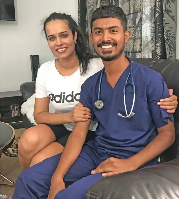  ?? Photo: Inoke Rabonu ?? Dr Roneel Kumar with his proud sister Priteshna Kumar at their home in Nakasi on December 24, 2021.