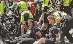  ??  ?? BUSTED: Boston police arrested 33 people during and after Saturday’s ‘Free Speech Rally,’ above and right. Arraignmen­ts begin tomorrow and include charges for public drinking and carrying a gun.