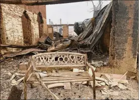  ?? AP ?? A metal bench stands in front of a burned structure in Greenville, Calif., after the Dixie Wildfire on Thursday.