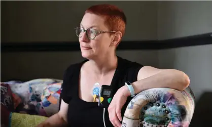  ?? Photograph: Glyn Kirk/ AFP/Getty Images ?? Jenny Judge, a long-term sufferer with post-Covid-19 symptoms, wears a heart monitor in her home in England.