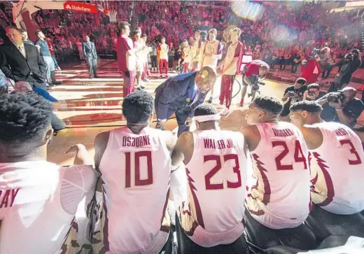  ?? /MARK WALLHEISER/AP ?? Florida State head coach Leonard Hamilton, center, and the Seminoles enter the ACC Tournament as the top seed for the first time.