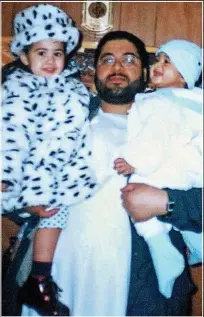  ??  ?? Father: Shaker Aamer with two of his children