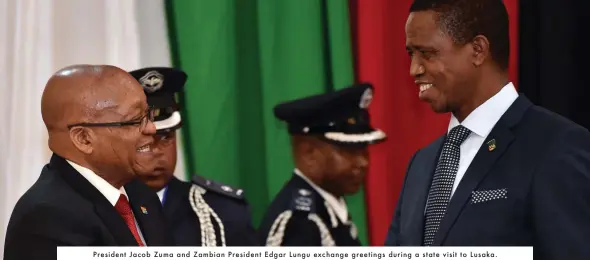  ??  ?? President Jacob Zuma and Zambian President Edgar Lungu exchange greetings during a state visit to Lusaka.