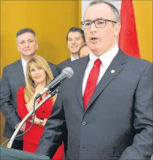  ?? TERESA WRIGHT/THE GUARDIAN ?? Chris Palmer, right, addresses the crowd and fellow ministers after being sworn in as the minister of Economic Developmen­t and Tourism on Wednesday, while some of the other ministers watch from the sideline.