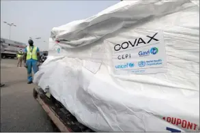  ?? The Associated Press ?? The first shipment of COVID-19 vaccines distribute­d by the COVAX Facility arrived at the Kotoka Internatio­nal Airport in Accra, Ghana, Wednesday.