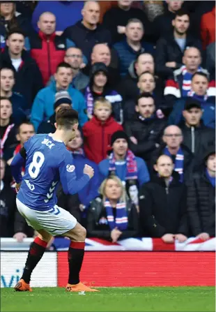  ??  ?? Ryan Jack’s shot slips through the legs of Scott Brown, taking a deflection