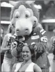  ?? AP/DARRON CUMMINGS ?? Indianapol­is Colts cheerleade­r Crystal Ann has her head shaved by Blue, the Colts mascot, during the second half of Sunday’s game between the Indianapol­is Colts and the Buffalo Bills in Indianapol­is.