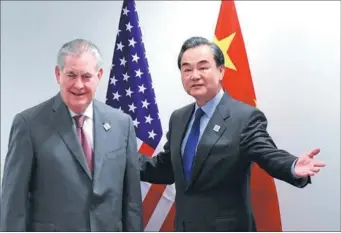  ?? CHINA NEWS SERVICE ?? Foreign Minister Wang Yi and US Secretary of State Rex Tillerson meet on the sidelines of a gathering of foreign ministers of the G20 leading and developing economies at the World Conference Center in Bonn, Germany, on Friday.