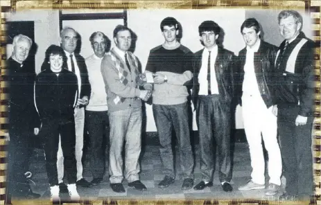  ?? (Pic: The Avondhu Archives) ?? Michael Jordan, chairman Fermoy Handball Club, making a presentati­on to Morgan Spillane, Fermoy, prior to his departure to England in 1987. Also included are Fr Hennessy, CC Fermoy and members of Fermoy Handball Club.