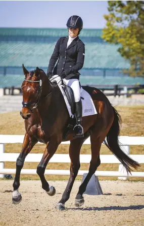  ??  ?? Alison O’Dwyer trained Fifth Ace to a win in the dressage portion of the Thoroughbr­ed Makeover.