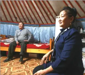  ??  ?? This picture taken on Dec 29, 2018 shows Buyan-Ulzii Badamkhand and her husband in their ger in Ulaanbaata­r.