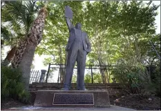  ?? ASSOCIATED PRESS ?? A statue depicts a man holding the state law that made Juneteenth a state holiday in Galveston, Texas. The inscriptio­n on the statue reads “On June 19, 1865, at the close of the Civil War, U.S. Army General Gordon Granger issued an order in Galveston stating that the 1863 Emancipati­on Proclamati­on was in effect. That event, later known as “Juneteenth,” marked the end of slavery in Texas. Celebrated as a day of freedom since then, Juneteenth grew into an internatio­nal commemorat­ion and in 1979 became an official Texas holiday through the efforts of State Representa­tive Albert (AL) Edwards of Houston.”