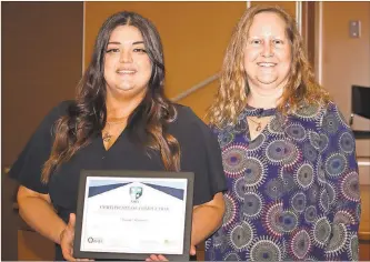  ?? GNTC ?? Deseri Wooten (right), Nursing Simulation Lab coordinato­r at GNTC, congratula­tes GNTC Nursing student Vanessa Elise Blackmon, who completed Blue Ridge AHEC’s two-year scholar’s program.