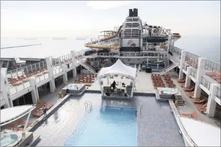  ?? PICTURE: BLOOMBERG
ORE HUIYING ?? A pool deck and water slides are seen aboard the Genting Dream luxury cruise ship berthed in Singapore recently.