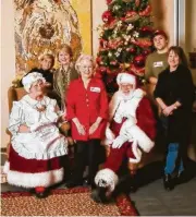 ??  ?? Among the agents and staff supporting Santa and Mrs. Claus at the annual John Daugherty, Realtors Ronald McDonald House holiday dinner were (left to right) Dori Singer, Cheri Fama, Agatha Brann, Bryan Vanas and Valerie Decker.