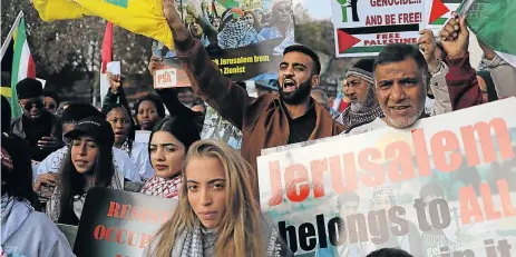  ?? Picture: ALON SKUY ?? SHOW OF ANGER: Pro-Palestinia­n groups protest outside the US consulate in Sandton yesterday after the deaths in Gaza