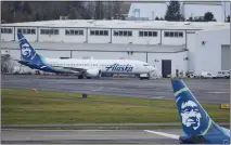  ?? CRAIG MITCHELLDY­ER — THE ASSOCIATED PRESS ?? The Alaska Airlines 737 Max 9 that made an emergency landing at Portland Internatio­nal Airport after a part of the fuselage broke off midflight en route to Ontario Internaton­al Airport on Friday, is parked at a maintenanc­e hanger in Portland, Ore., on Saturday.