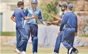  ?? PIC/PTI ?? M S Dhoni with his teammates during the Vijay Hazare Trophy cricket match against Services at Kalyani in West Bengal on Tuesday