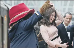  ?? PICTURE: PA WIRE. ?? ROYAL TWIRL: The Duchess of Cambridge enjoys an impromptu dance with Paddington Bear.