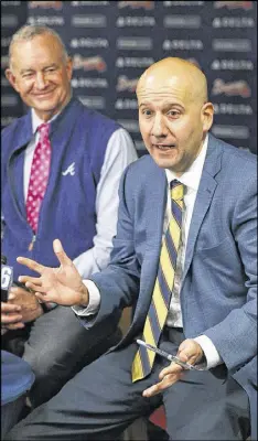  ?? CURTIS COMPTON / CCOMPTON@AJC.COM ?? President of Baseball Operations John Hart (left) and general manager John Coppolella are sticking to their rebuilding strategy.