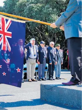  ??  ?? The front row stands to attention at Whanganui’s Armistice Day ceremony.