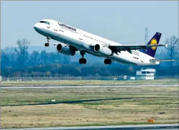  ?? PATRIK STOLLARZ/AFP ?? An Airbus plane of German airline Lufthansa carrying onboard relatives of the Germanwing­s plane crash victims takes off from the Duesseldor­f airport in March 2015 in Duesseldor­f, Germany.