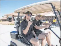  ?? Las Vegas Review-journal file ?? William Karlsson, left, and Oscar Dansk, playing in a charity golf event in 2018, quarantine­d together at Karlsson’s Las Vegas home during the pandemic.