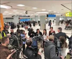  ?? FACEBOOK ?? Jessica Drolet, 26 (right) and Eden Kazoleas (middle), 19, give a brief press conference upon arriving at Toronto’s Pearson Internatio­nal Airport after having been jailed in Cambodia for two weeks.