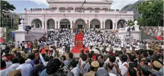  ?? – Reuters ?? CHARISMATI­C LEADER: Supporters gather outside the Rajaji hall in Chennai during the funeral of India’s Tamil leader Muthuvel Karunanidh­i, on Wednesday.