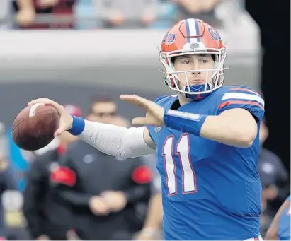  ?? JOHN RAOUX/AP ?? UF redshirt senior quarterbac­k Kyle Trask waited patiently for his chance, and capitalize­d when he finally got it last season. Those qualities could serve the Gators well during a season that could feature COVID-19 interrupti­ons.