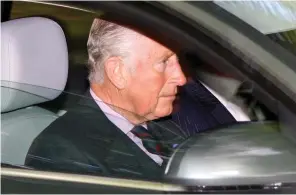  ??  ?? Under fire: Charles driving himself to a church service yesterday