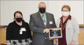  ?? ?? City Manager Jeremy Howard and Recreation Director Joy Simmer accept the Business Partner of the Year award.