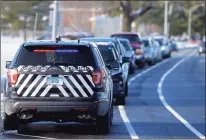  ?? ?? Cars line up at Thursday at Danbury’s new COVID-19 testing site at the Patrick R. Waldron Veterans Hall parking lot on Memorial Drive.