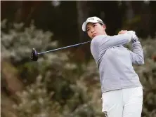  ?? Scott Heppell / Associated Press ?? Hinako Shibuno tees off on No. 3 in Muirfield, Scotland. She recorded one of her eight first-round birdies on the hole.