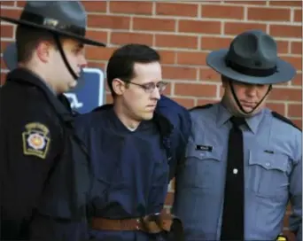  ?? BUTCH COMEGYS — THE TIMES & TRIBUNE VIA AP, FILE ?? In this file photo, Eric Frein is led away by Pennsylvan­ia State Police Troopers at the Pike County Courthouse after his preliminar­y hearing in Milford, Pa. Prosecutor­s are seeking the death penalty against Frein, who they said targeted state police...