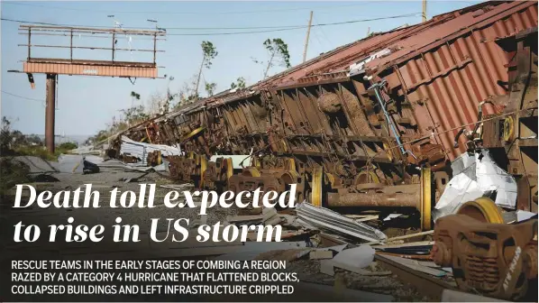  ?? AFP ?? A train is seen tipped over from storm winds in the aftermath of Hurricane Michael in Panama City, Florida Thursday. The death toll from the hurricane, which slammed into the Florida coast as a Category 4 storm, has risen to at least 11,