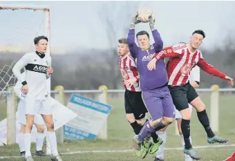  ??  ?? Coxhoe keeper Jack Elcoat gathers a high ball at Sunderland West End last week. Pic by Tim Richardson.