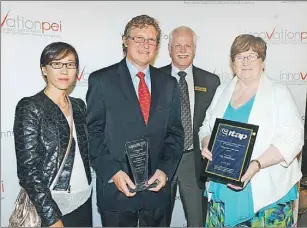  ?? NIGEL ARMSTRONG/THE GUARDIAN ?? The Innovation and Technology Associatio­n of P.E.I. held its annual gala awards dinner recently in Charlottet­own. On hand were, from left, Chunying Li, head of operations and Jason Aspin, president of Aspin Kemp & Associates, Paul Lypaczewsk­i,...