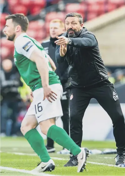  ??  ?? Lively on the sidelines: Derek McInnes issues instructio­ns in the Scottish Cup semi-final against Hibs