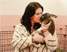  ?? Jim Michaud/Hearst Connecticu­t Media ?? Becky Bernardo, president of Everybunny Counts, with Tabitha, in the group’s new Ellington location.