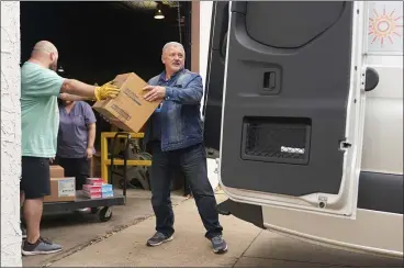  ?? COOPER NEILL — THE NEW YORK TIMES ?? Medical supplies from the National Stockpile in Arlington, Texas, are loaded into a Catalyst Health Network van for distributi­on to testing sites on Tuesday. Doctors say they are critically low on swabs that are needed for tests.