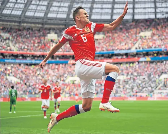  ?? Picture: Getty Images. ?? Host nation Russia got off to a flyer at the World Cup as they thumped Saudia Arabia 5-0 in the Group A tournament opener, with Denis Cheryshev, above, scoring twice at the Luzhniki Stadium in Moscow. See pages 58 and 59.