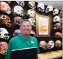  ?? John Raoux / Associated Press ?? Steve Spurrier stands in front of a display of helmets of teams that he previously played for or coached at his new restaurant, the Gridiron Grill, on June 17 in Gainesvill­e, Fla. The restaurant doubles as Spurrier's personal museum.