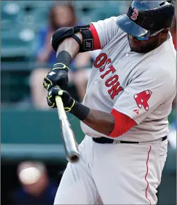  ?? Associated Press ?? Boston Red Sox designated hitter David Ortiz makes contact for a ground out to first during the first inning against the Texas Rangers on Saturday in Arlington, Texas.