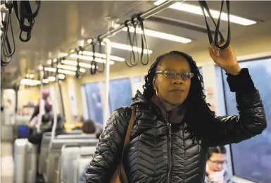  ?? Kate Munsch / Special to The Chronicle ?? BART Board President Lateefah Simon, seen riding a train in January, is a “progressiv­e policing” advocate.