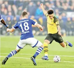  ??  ?? Borussia Dortmund’s Jadon Sancho shoots at goal. — Reuters photo