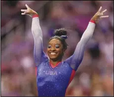  ?? Associated Press ?? PEAK PERFORMANC­E — Simone Biles celebrates her performanc­e on the vault during the women’s U.S. Olympic Gymnastics Trials on June 25 in St. Louis.