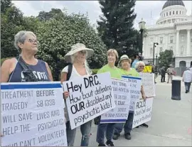  ?? Anita Chabria Los Angeles Times ?? PEOPLE WHO have loved ones with mental illness demonstrat­e in Sacramento this week in support of Gov. Gavin Newsom’s CARE Court plan to expedite care.